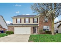 Charming two-story home with a two-car garage, brick facade, and well-maintained lawn at 8650 N Springview Dr, McCordsville, IN 46055