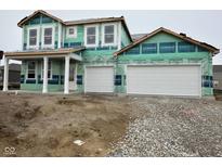New construction home featuring a two-car garage and a covered front porch, ready for finishing touches at 240 Ames Dr, Whiteland, IN 46184