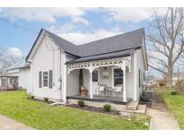 Charming home with a cozy front porch, decorative trim, and a well-maintained lawn at 508 Mount St, Greenfield, IN 46140