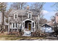 Charming two-story home with dormer windows and a welcoming front porch at 5718 E Pleasant Run Parkway North Dr, Indianapolis, IN 46219