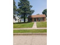 Charming single-story home with well-maintained lawn and mature trees at 351 N Smart St, Greenwood, IN 46142