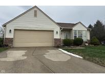 Charming single-story home with vinyl siding, attached garage, and well-maintained landscaping at 4320 Lucky Ct, Indianapolis, IN 46203