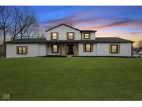 Charming two-story home with a well-manicured lawn and inviting curb appeal at 8315 N Payne Rd, Indianapolis, IN 46268