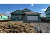 New construction home showcasing a two-car garage, covered front entry, and basic landscaping in a developing community at 915 Saddlebrook Farms Blvd, Whiteland, IN 46184