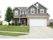 Inviting two-story home with a manicured lawn and a two-car garage at 981 Redwood Dr, Franklin, IN 46131