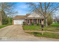 Charming one-story home with a two-car garage and well-maintained lawn at 10407 Stillwell Ct, Avon, IN 46123
