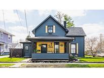 Charming two-story home with a well-manicured lawn and inviting front porch at 310 W Staat St, Fortville, IN 46040