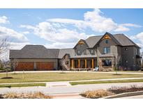 Stunning two-story home featuring an attached three-car garage and a welcoming front porch at 3899 Chapel Hill Ct, Bargersville, IN 46106