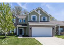 Inviting two-story home with a brick and siding exterior, complemented by a well-maintained lawn at 4363 Rhapsody Ln, Indianapolis, IN 46235