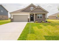 Charming single-Gathering home featuring a brick facade, well-manicured lawn, and an attached two-car garage at 895 Saddlebrook Farms Blvd, Whiteland, IN 46184