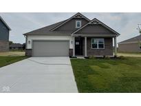 Charming single-story home featuring brick and siding exterior and attached two car garage at 895 Saddlebrook Farms Blvd, Whiteland, IN 46184