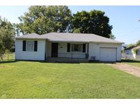 Charming one-story home with a well-maintained lawn and attached single-car garage at 10327 Old National Rd, Indianapolis, IN 46231
