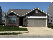 Charming single-Gathering home with brick and siding exterior and a two-car attached garage at 10869 Spirit Dr, Ingalls, IN 46048