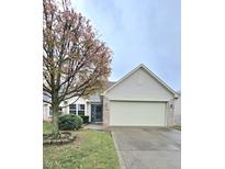 Charming single-Gathering home featuring a two-car garage and well-maintained landscaping at 10949 Harness Way, Indianapolis, IN 46239