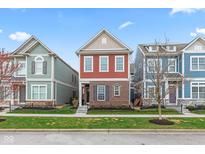 Charming curb appeal with a well-maintained lawn and classic architectural details at 13245 E 131St St, Fishers, IN 46037