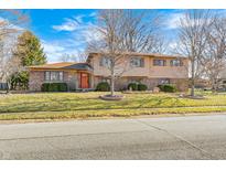 Charming two-story home with a combination brick and siding exterior and well-maintained landscaping at 920 Mellowood Dr, Indianapolis, IN 46217