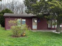 Charming single-story home with a well-maintained lawn and mature landscaping provides a peaceful setting at 5736 W 300 S, Anderson, IN 46011