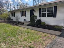 Charming single-story home with black shutters and a freshly landscaped yard at 1024 Foltz St, Indianapolis, IN 46241