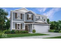 Charming two-story home with a well-manicured lawn and a two-car garage at 16995 Fulsam, Westfield, IN 46074