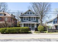 Charming two-story home with a landscaped front yard, well-maintained exterior, and inviting curb appeal at 4030 N Illinois St, Indianapolis, IN 46208