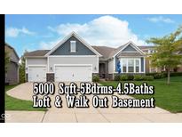 Charming two-story home with a two-car garage, manicured lawn, and stylish exterior finishes at 4196 Parliament Way, Avon, IN 46123