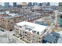 An aerial view showcases the modern architecture and urban setting of the property at 504 N Park Ave # 3, Indianapolis, IN 46202