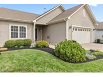 Charming home features a well-maintained lawn and tidy landscaping, enhancing its curb appeal at 11182 Black Gold Dr, Noblesville, IN 46060