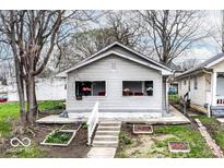 Charming single-story home featuring light-colored siding and a small front yard garden area at 1270 Eugene St, Indianapolis, IN 46208