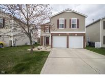 Charming two-story home featuring a two-car garage and classic design elements at 15398 Border Dr, Noblesville, IN 46060
