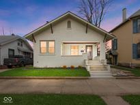 Charming single-Gathering home with a manicured lawn and inviting porch steps at twilight at 270 W Broadway St, Shelbyville, IN 46176