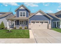 Charming blue two-story home with a two-car garage and inviting front porch at 622 Ehrlich Ln, Westfield, IN 46074