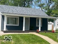 Charming single-story home with a welcoming front porch and well-maintained lawn at 2336 St Paul St, Indianapolis, IN 46203