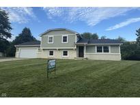 Charming two-story home with a well-manicured front lawn and inviting curb appeal at 439 Pleasantview Dr, Greenwood, IN 46142