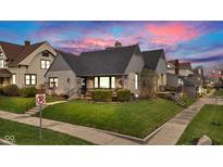 Charming home featuring stone accents, a manicured lawn, and beautiful landscaping at 524 N Meridian St, Lebanon, IN 46052