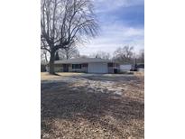 Charming brick and siding single story home with attached garage and paved drive at 6426 Maple Lawn Rd, Indianapolis, IN 46241