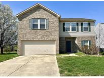 Two-story home with brick and siding, green shutters, a two-car garage, and a well-manicured lawn at 6518 Sonesta Dr, Indianapolis, IN 46217