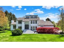 Stunning two-story home with manicured lawn, vibrant landscaping, and a grand entryway at 7531 Normandy Blvd, Indianapolis, IN 46278