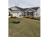 Charming single-story home with a combination of stone and siding and a well-manicured lawn at 99 Gnarled Oak Ln, Whiteland, IN 46184