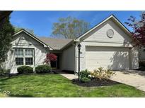 Charming single-Gathering home boasts a two-car garage and well-maintained landscaping at 10799 Belair Dr, Carmel, IN 46280