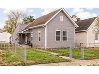Charming single-Gathering home with gray siding, well-maintained lawn, and welcoming curb appeal at 1429 Linden St, Indianapolis, IN 46203