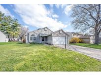 Charming single-Gathering home featuring a two-car garage and a well-manicured lawn at 726 Westridge S Dr, Noblesville, IN 46062