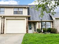 Charming townhome with attached garage, well-maintained lawn, and a welcoming front entrance at 1198 Paradise N Way # C, Greenwood, IN 46143