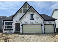 Under construction, a two-story home featuring a two-car garage and modern architectural details at 141 Creststone Blvd, Westfield, IN 46074