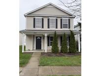 Charming two-story home with a quaint front porch, black shutters, and well-maintained landscaping at 14243 Clapboard Dr, Noblesville, IN 46060