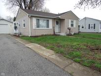 Charming single-story home with neutral siding, white trim, and a well-maintained front lawn at 150 E Carlisle St, Mooresville, IN 46158