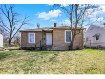 Charming single story home with brick veneer and a yard with mature trees at 3343 N Drexel Ave, Indianapolis, IN 46218
