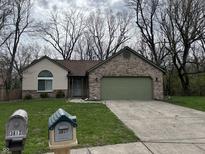 Charming one-story home featuring brick accents and a well-maintained lawn at 3817 Cologne Ct, Indianapolis, IN 46228