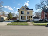 Charming two-story home with black shutters and front porch at 509 E Columbus St, Martinsville, IN 46151