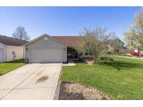 Charming one-story home with a two-car garage and well-maintained front lawn at 6953 Beargrass Ct, Indianapolis, IN 46241