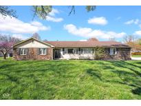 Charming single-story brick home with a well-maintained lawn and mature trees under a bright blue sky at 758 Stafford Rd, Plainfield, IN 46168